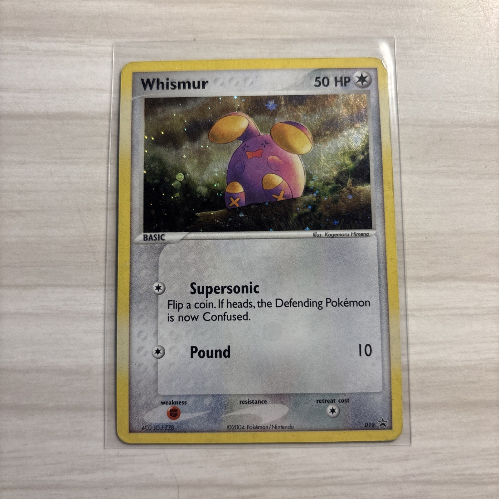 Whismur # 019 Nintendo Black Star Promo 19 Pokemon Card - SWIRL Left Side