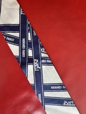 Hermès Silk Twilly Scarf, featuring the iconic "Bolduc" ribbon