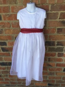 white dress with red sash
