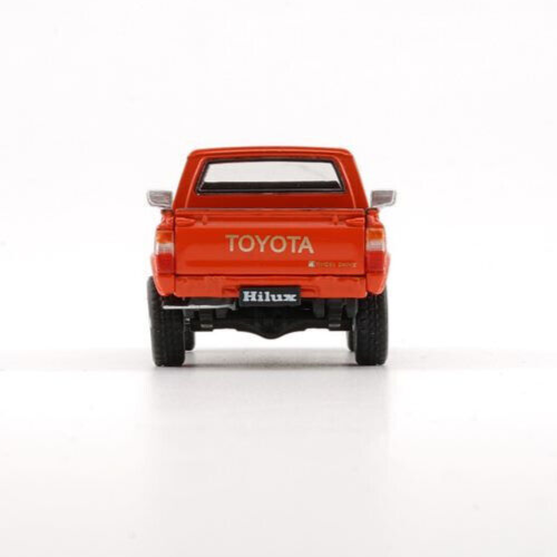 BM Creations 1980 Toyota Hilux - Orange - LHD 1:64 Scale Diecast
