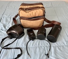 Minolta XG-M 35mm SLR Film Camera with 2 zoom lenses, automatic flash and case