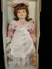 limited collection genuine porcelain doll and matching miniature ornament