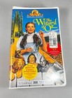 MGM The Wizard Of Oz 1996 VHS cover with Dorothy, Lion, Emerald City, and Wizard of Oz logo.