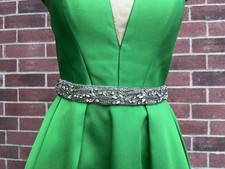 Green Formal Gown with Embellished Waist and Ruffled Shoulders