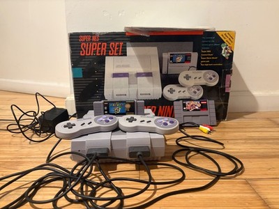 Super Nintendo  Console with box and two games, two controllers & manual