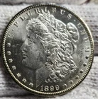 1899 O MORGAN SILVER DOLLAR COIN SILVER BETTER THAN UNCIRCULATED