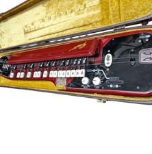 Suzuki Ran Taishogoto soprano in red with case and strap.