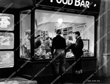 crp-20654 1941 Peter Moore & friend watch people eat film 49th Parallel crp-2065