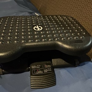 Mind Reader adjustable ergonomic under-desk footrest. It is designed to...