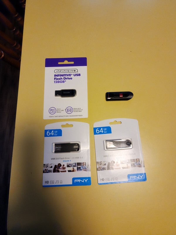 Infinitive USB Flash Drives 128 GB, 32GB (3) and 64GB (2) and a 64GB SanDisk