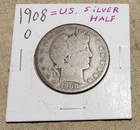 1908-O DATED BARBER SILVER HALF DOLLAR COIN IN GOOD CIRCULATED CONDITION OVERALL