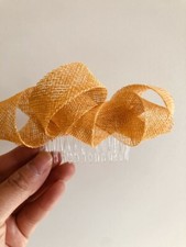 Yellow loop fascinator on a clear comb. Stunning on 