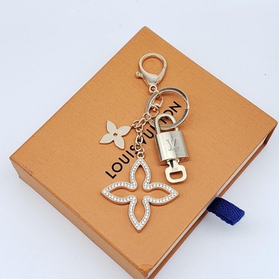 Authentic Louis Vuitton Gold Lock & Box w/ Unbranded Clover Bagcharm