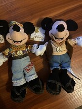 a Disney 8" Hippie Minnie Mouse And Mickey Bean Bag Beanie w/ tags.