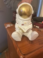 Sitting Astronaut Reading Book Figure