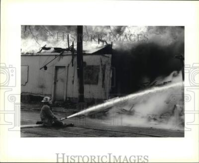 #ad 1996 Press Photo Firefighter Using Hose on Fire nod04287 $24.99
