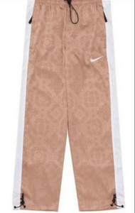 nike rose gold track pants
