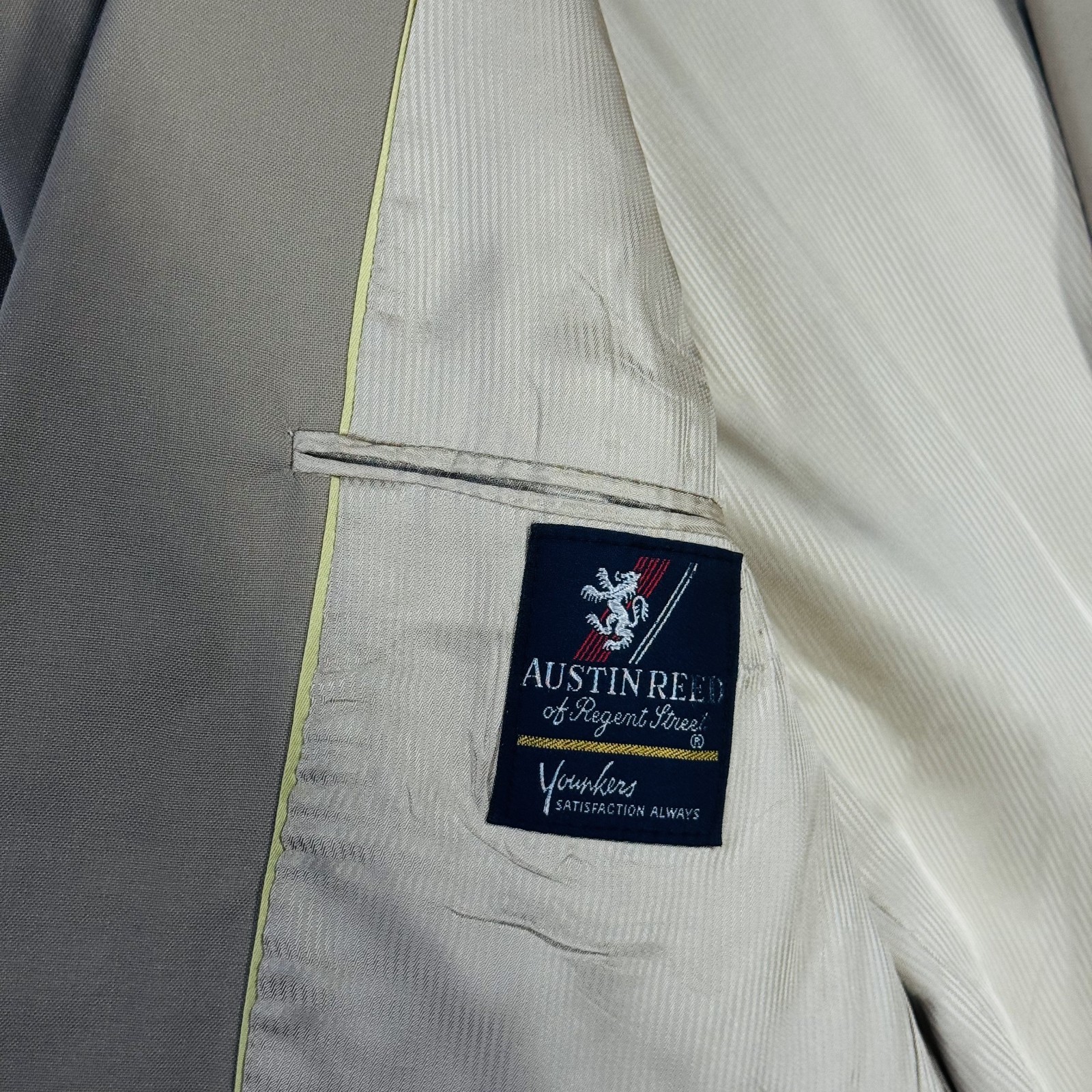 Ivory gold Austin Reed men’s blazer with blue inner lining, tan buttons, and “Of Regent Street” label.