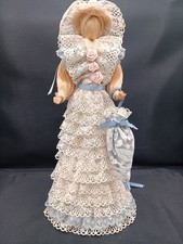 Straw Lady with an umbrella