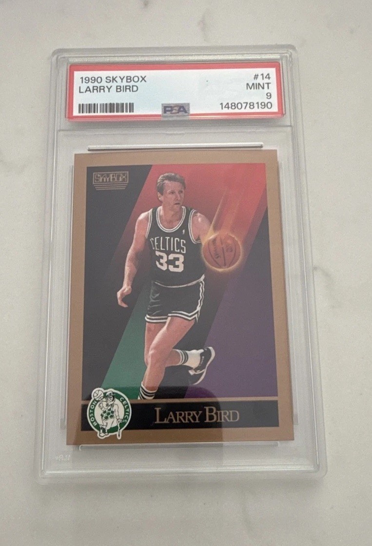 Larry Bird #14 Basketball Cards 1990 Skybox trading card — raw and PSA graded price guide