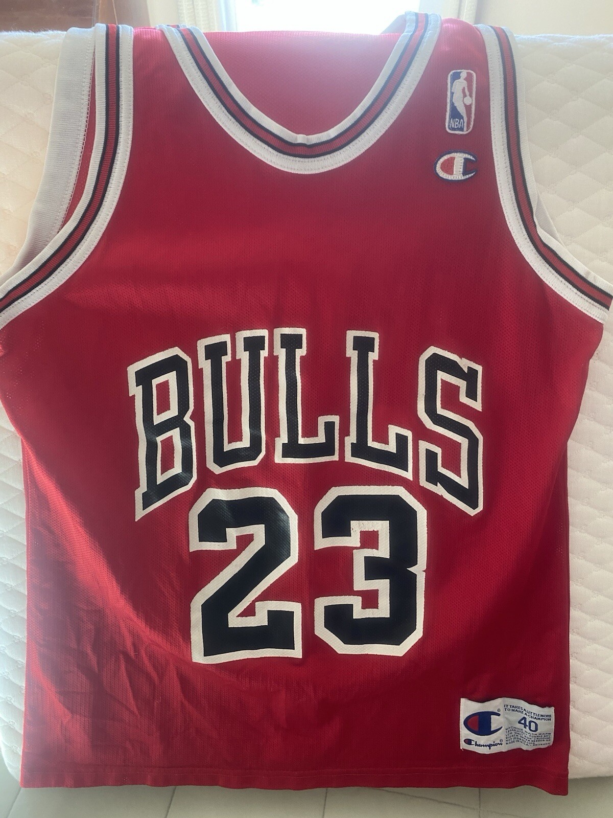 Michael Jordan Bulls #23 jersey, vintage and distressed-Champion adult M40.