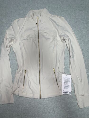 Lululemon NWT Define Jacket Nulu size 10 Light Ivory/Gold/Gold