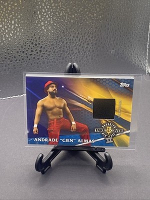 2017 Topps WWE Andrade Cien Almas NXT Takeover Event Used Mat Relic Gold #20/50
