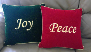 2 Christmas throw pillows Peace & Joy (red & green) 12" square w/gold binding