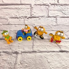 Juego de 4 estatuillas Garfield 1981 vintage con patines de fútbol y jeep