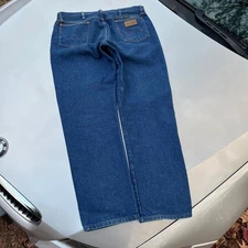 Vintage Cowboy Cut Wrangler blue denim jeans Has a bit of paint on the back