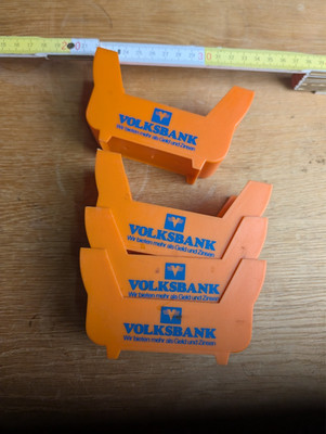 4 Bierdeckelhalter Orange   Werbeartikel der Volksbank