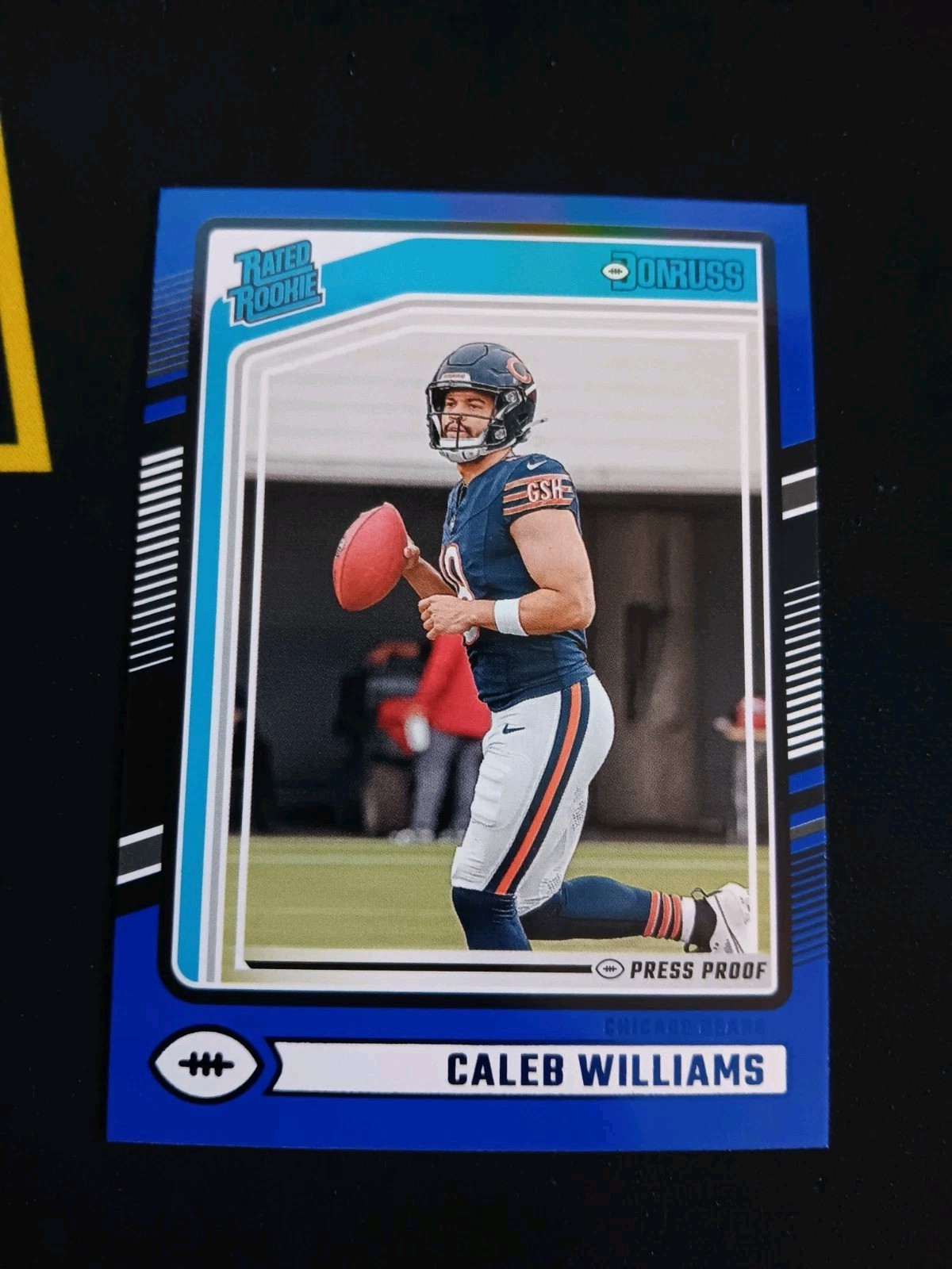 Caleb Williams 2024 Panini Donruss Rated Rookie #327 Blue Press Proof Bears
