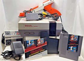 NES: Juego de acci&oacute;n - CIB - En muy buen estado - Versi&oacute;n naranja Zapper con juego, manuales e insertos
