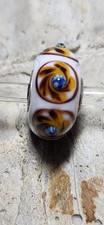 Trollbead Unique White Base With Blue And Maize Colors.