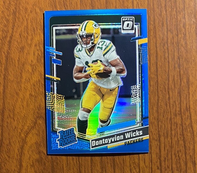 2023 Donruss Optic #249 Dontayvion Wicks Aqua Prizm Rated Rookie /299 Packers RC