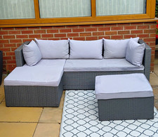 Grey Rattan-Effect Corner Garden Lounge Set with Grey Cushions & Footstool.
