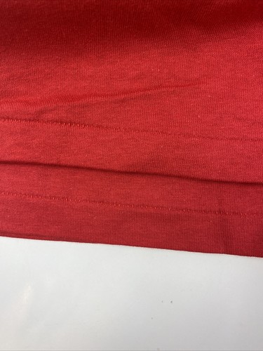 Folded red vintage Disneyland Mickey Mouse T-shirt with single stitch, white background, and USA Made label on collar.
