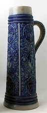 Good 19th C. German Metlach lidded beer stein having raised figured decoration
