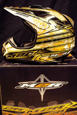 gold motocross helmet
