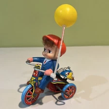 TIN LITHO WIND UP TOY- BOY RIDING TRICYCLE - WORKING - NICE
