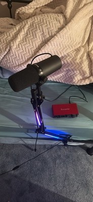 Shure SM7B Microphone with Scarlett 2i2 interface. XLR/USB-C cables. RGB stand.