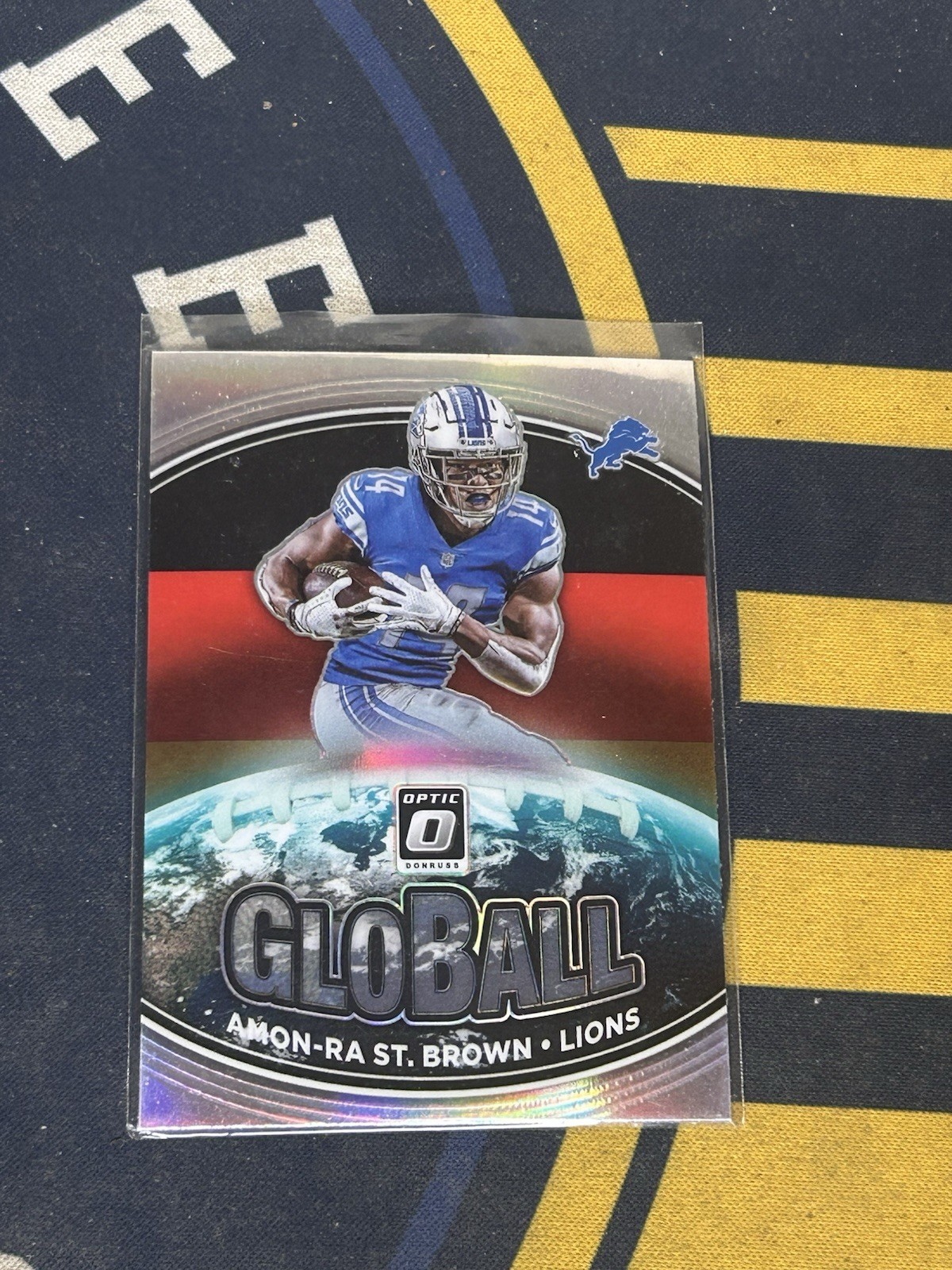 Amon-Ra St. Brown Panini Donruss Optic Globall #GB3 Base