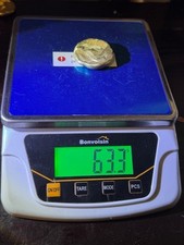 63 grams gold round 22k 3338.29 per troy oz