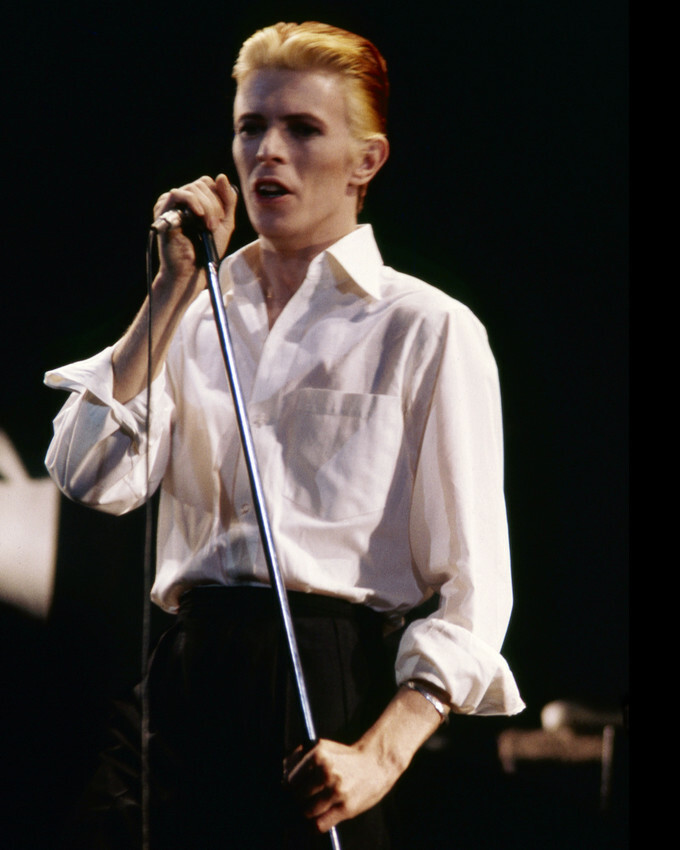 David Bowie slicked back hair and white shirt in concert 1980's