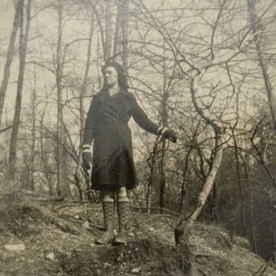 Vintage Photo Mountain Woman with Boots & Beret Walking Through the Woods
