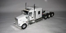 1/64 DCP 623 W900L 72" Tri-Axle AeroCab Flattop Sleeper (White)