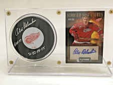 ALEX DELVECCHIO DETROIT RED WINGS SIGNED PUCK AND NUMBERED 4/50 PANINI CARD