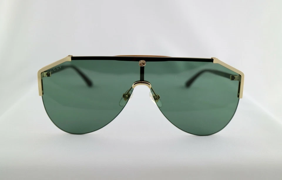 Gafas de sol Gucci GG0584S 002 marco dorado brazos habaneros lentes verdes protector unisex Foto 4 de 4