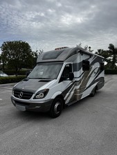 2014 Mercedes-Benz Sprinter Profile View with 2016 Ford Focus Hatchback