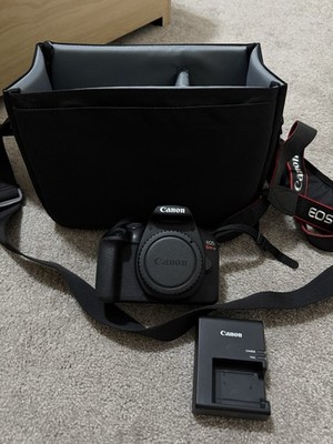 Canon  EOS Black. Comes With Battery Charger, Lens And Camera Bag.